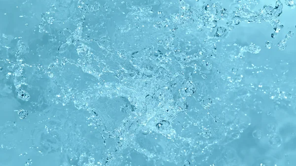 Vodní Stříkance Izolované Měkkém Modrém Pozadí Zastavit Pohyb Explodující Vody — Stock fotografie