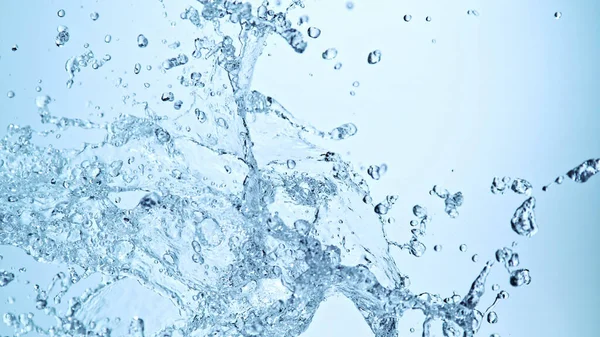 Νερό Splash Απομονώνονται Μαλακό Μπλε Φόντο Παγώστε Την Κίνηση Του — Φωτογραφία Αρχείου