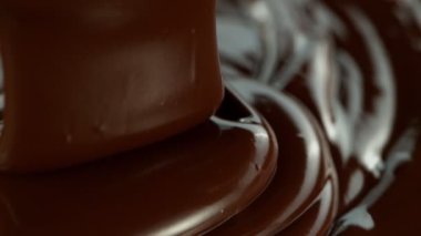 Super Slow Motion of Pouring Real Dense Melted Chocolate. Filmed with High Speed Cinema Camera, 1000fps. 