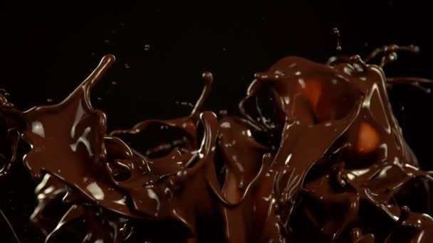 Super Slow Motion Melted Chocolate Splashing Waves Shapes Isolated Black — Wideo stockowe