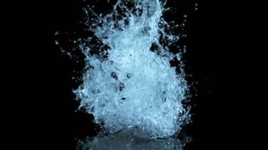 Super slow motion of splashing water shape on black background. Filmed on high speed cinema camera, 1000fps.