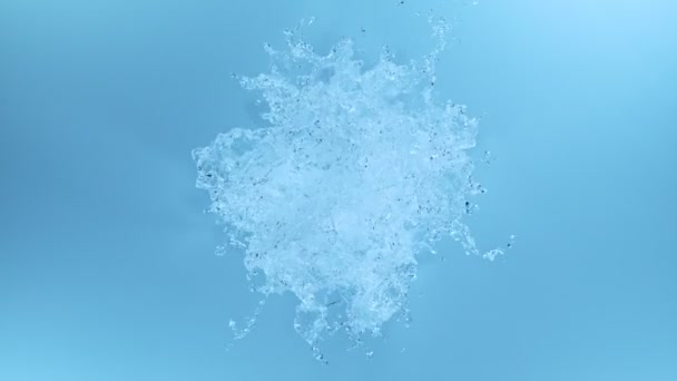 Super Slow Motion Splashing Water Shape Blue Background Filmed High — Stockvideo