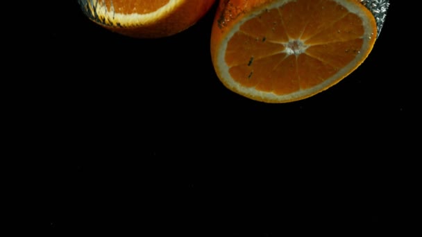 Super Slow Motion Falling Orange Pieces Isolated Black Background Filmed — Video Stock