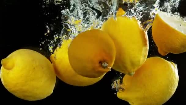 Super Slow Motion Falling Lemon Pieces Isolated Black Background Filmed — Video Stock