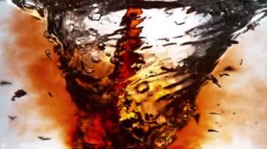 Super slow motion of pouring black tea into water in twister shape. Filmed on high speed cinema camera, 1000fps. Speed ramp effect.