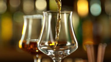 Super slow motion of pouring rum into glass. Filmed on high speed cinema camera, 1000 fps.