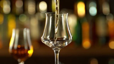 Super slow motion of pouring rum into glass. Filmed on high speed cinema camera, 1000 fps.