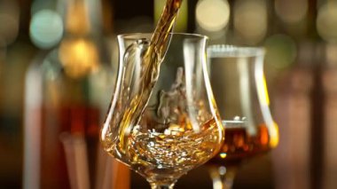 Super slow motion of pouring rum into glass. Filmed on high speed cinema camera, 1000 fps. Speed ramp effect.