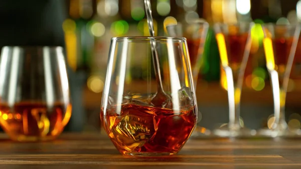 Detail Stiring Whiskey Glass Ice Bar Background — Stock fotografie