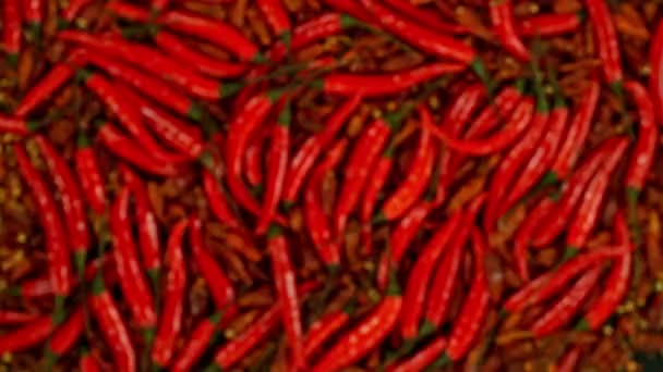 Super Slow Motion Flying Rotating Red Chilli Peppers Filmado Cámara — Vídeos de Stock