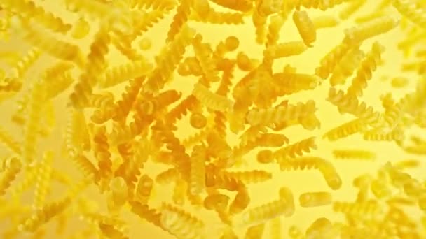 Super Slow Motion Flying Uncooked Italian Pasta Fusilli Filmed High — Stock Video