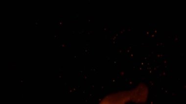 Super Slow Motion of Fire Sparks Isolated on Black Background. Filmed on High Speed Cinema Camera, 1000 fps.