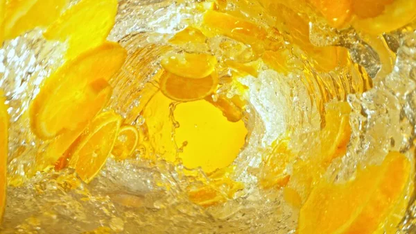 Textúra Fröccsenő Víz Narancs Szeletek Absztrakt Ital Háttér Fagyasztott Mozgás — Stock Fotó