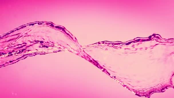 ピンクのバックグラウンドに分離されたピンク回転水をスプラッシュするスーパースローモーション 高速シネマカメラで撮影 1000 Fps — ストック動画