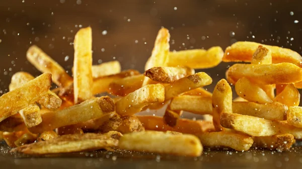 French Fries Fried Potatoes Hitting Table Fast Food Meal Freeze — Stock Photo, Image