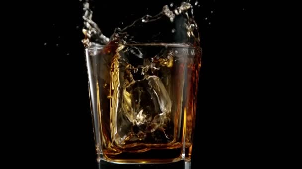 Super Slow Motion Falling Ice Cube Whiskey Drink Camera Motion — Vídeos de Stock