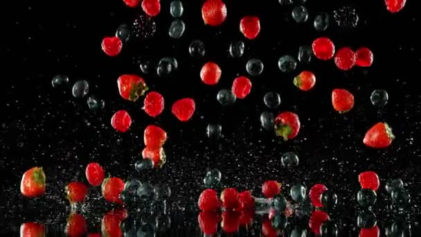 Super Slow Motion Falling Berries Water Black Background Filmed High — Stock Video