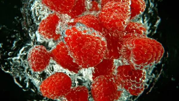 Bunch Fresh Raspberries Dropped Water Air Bubbles Splashes Isolated Black — Stock Photo, Image