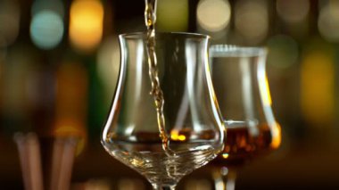 Super slow motion of pouring rum into glass. Filmed on high speed cinema camera, 1000 fps.