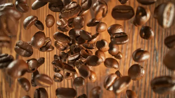 Freeze Motion Flying Coffee Beans Old Wooden Planks Overhead Shot Royalty Free Stock Images