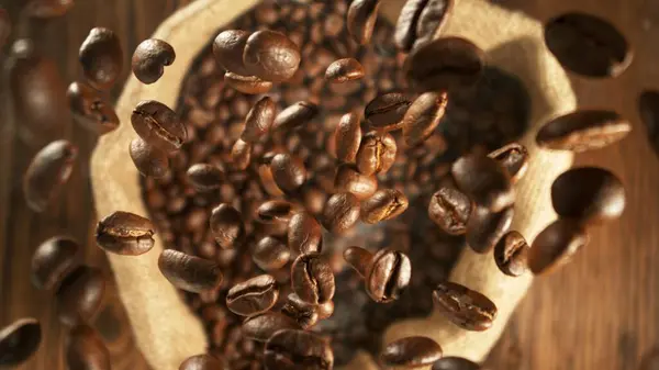 Freeze Motion Flying Coffee Beans Jute Sack Overhead Shot Stock Image