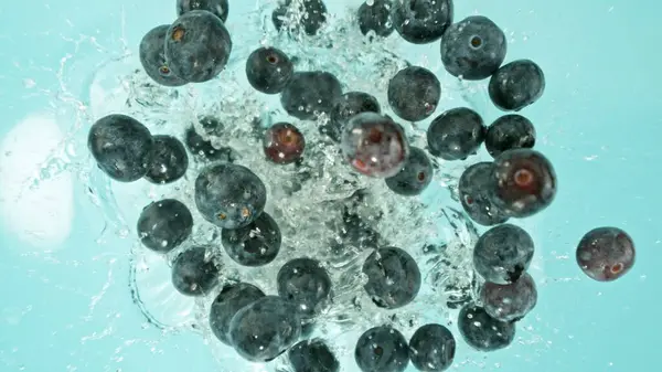 Freeze Motion Blueberries Falling Water Splashing Overhead Shot Fresh Fruit Stock Image