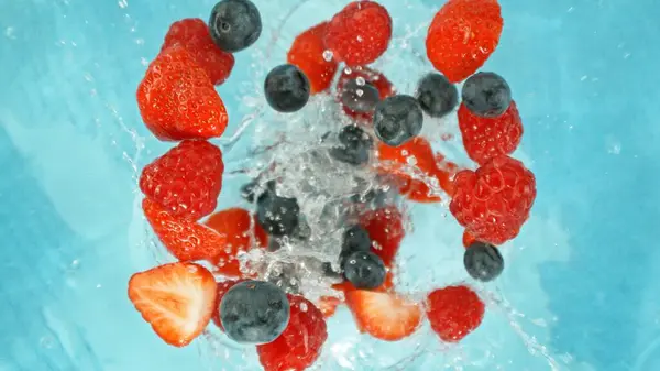 Freeze Motion Berries Falling Water Splashing Overhead Shot Fresh Fruit Stock Picture