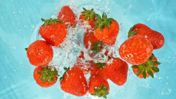 Freeze Motion Strawberries Falling Water Splashing Overhead Shot Fresh Fruit Stock Picture