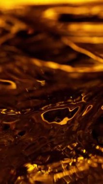 Koyu Altın Kahve Yüzeyi 'nin Süper Yavaş Hareketi. Yüksek Hız Sinema Kamerası, 1000fps.