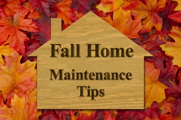 秋のホームメンテナンスのヒント赤とオレンジの葉の家のサイン — ストック写真