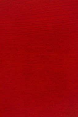 Mesajınız için ya da doku olarak kullanacağınız kopya alanı olan tahıl dokusu içeren parlak kırmızı taneli ahşap arkaplan