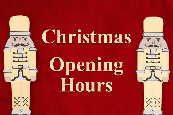 Christmas Opening Hours Message Gold Nutcrackers Red Plush — Stock Photo, Image