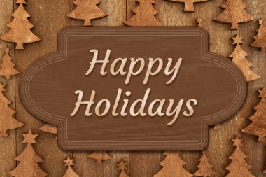 Kahverengi ahşap bir tabelanın üzerinde mutlu tatiller.