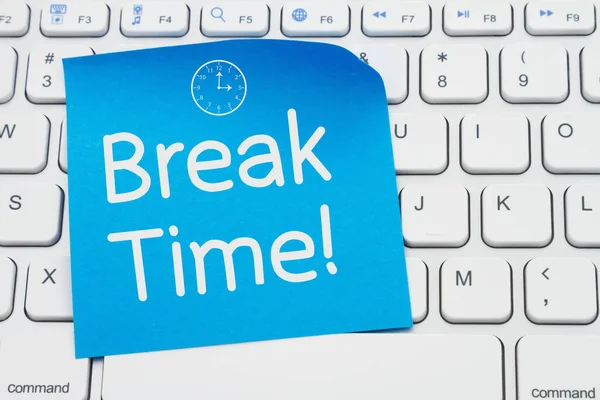 Break Time message on a blue sticky note on a gray computer keyboard for time to take a break from screen time message