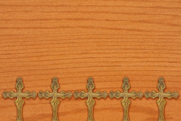 Bronze religious cross background on wood for your faith and religion message
