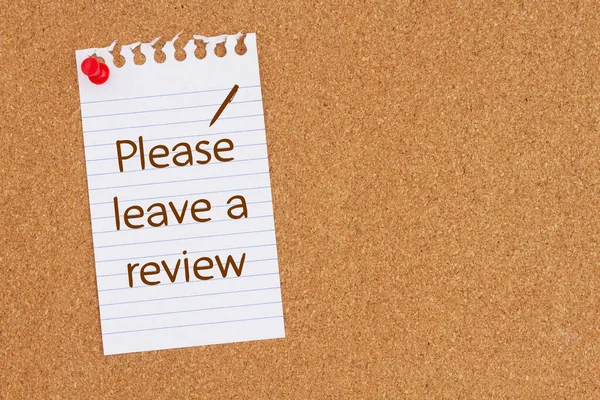 Please leave a review on ruled paper with a pushpin on a corkboard