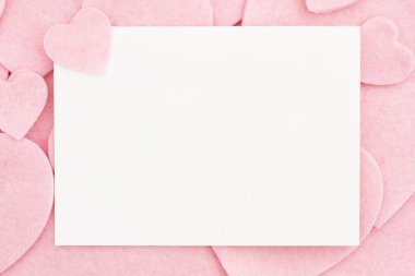 Blank greeting card with lots of felt pink hearts with space for your message