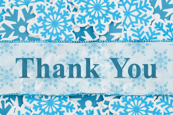 Thank you message on banner with blue snowflakes for winter thanks