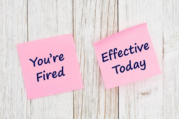 Youre Fired Effective Today Message Yellow Sticky Note Weathered Wood — Stock Photo, Image