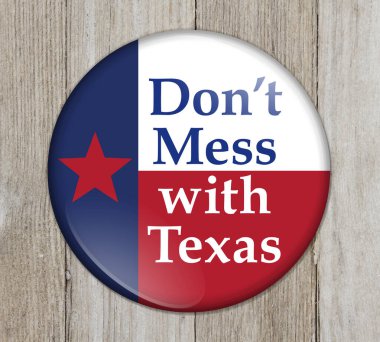 Teksaslı eski bir deyiş düğmesi, Teksas bayrağıyla düğmeli, yıpranmış ahşap üzerinde Teksas 'la uğraşma.