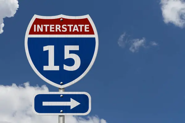 USA Interstate 15 highway sign, Red, white and blue interstate highway road sign with number 15 with sky background
