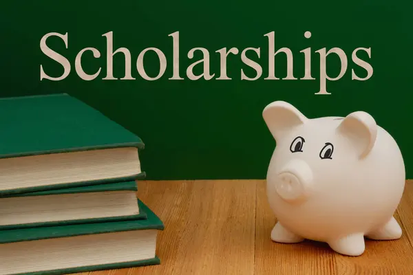 Scholarship money for education with piggy bank, books, desk and chalkboard