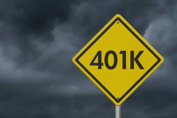 Retirement 401k risks message on warning road sign isolated with stormy sky