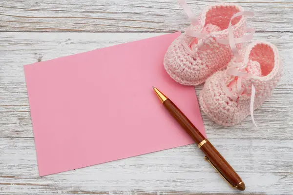 Pink Baby Booties Pink Greeting Card Pen Weathered Wood Space — Stock Photo, Image