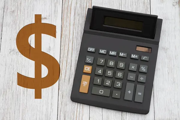 Черный Калькулятор Табличкой Золотой Доллар Большим Дисплеем Столе Выветренной Древесины Стоковое Фото
