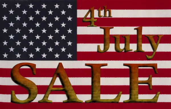 7月4日の米国販売のための星および縞が付いている米国の旗との販売のメッセージ ストックフォト