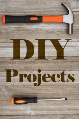 DIY projects list with orange screwdriver and hammer on weathered rustic wood  clipart