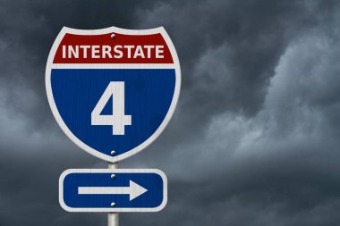 USA Interstate 4 highway sign, Red, white and blue interstate highway road sign with number 4 with stormy sky background clipart