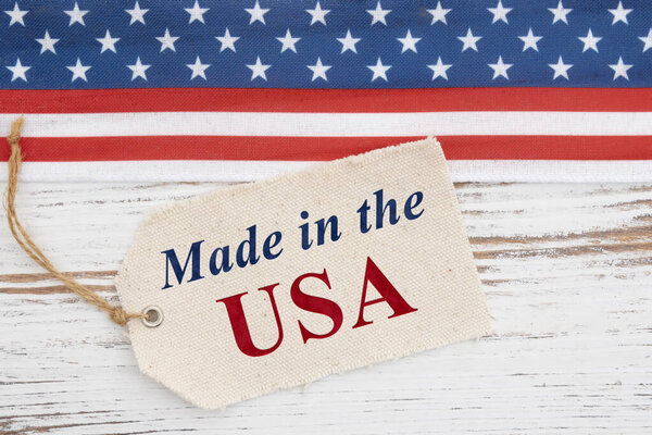 Made in the USA price tag with retro USA red, white and blue stars on weathered wood for American-made product branding or patriotic marketing 