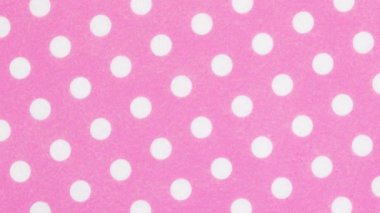 Parti için parlak pembe benek dokusu arka planı ve mutlu temalar yakınlaştırın ve döndürün